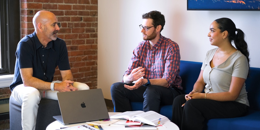 Charlie Paterson collaborating with two colleagues