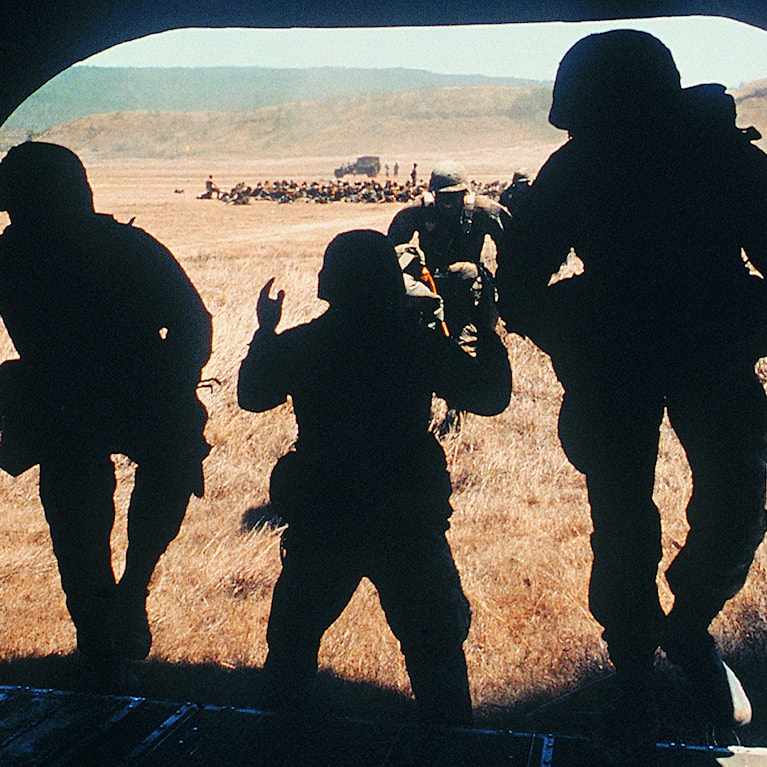 Soldiers entering military transport