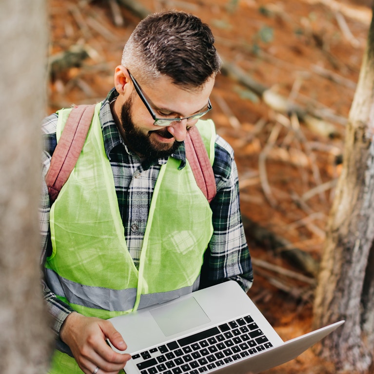 Ranger monitoring the woodland ecosystem