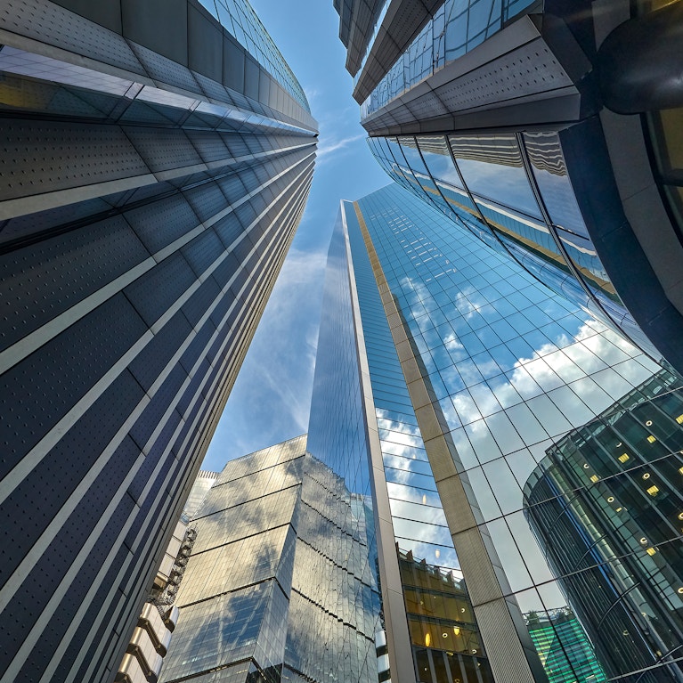 Low angle view looking down Lime Street to Lloyds of London Building, The Scalpel Building, Willis Building and The Leadenhall Building in the City of London