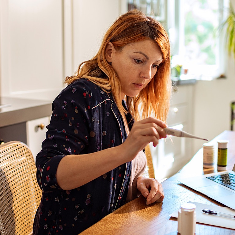 Women consulting GP via her laptop