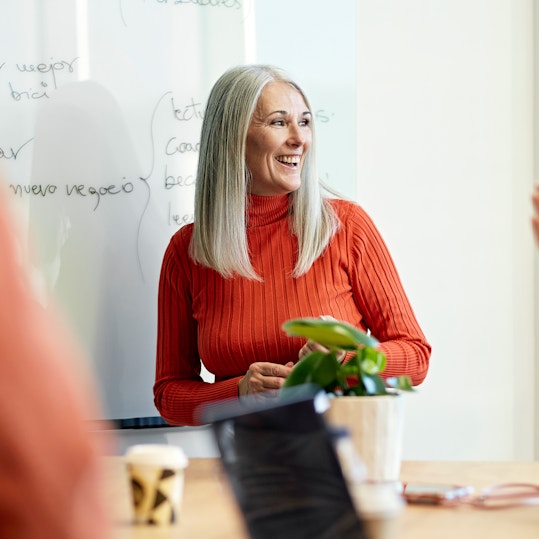 Woman presenting to a team.