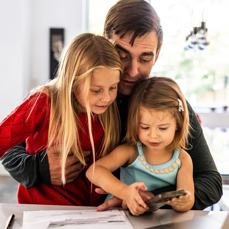 Family at home using devices