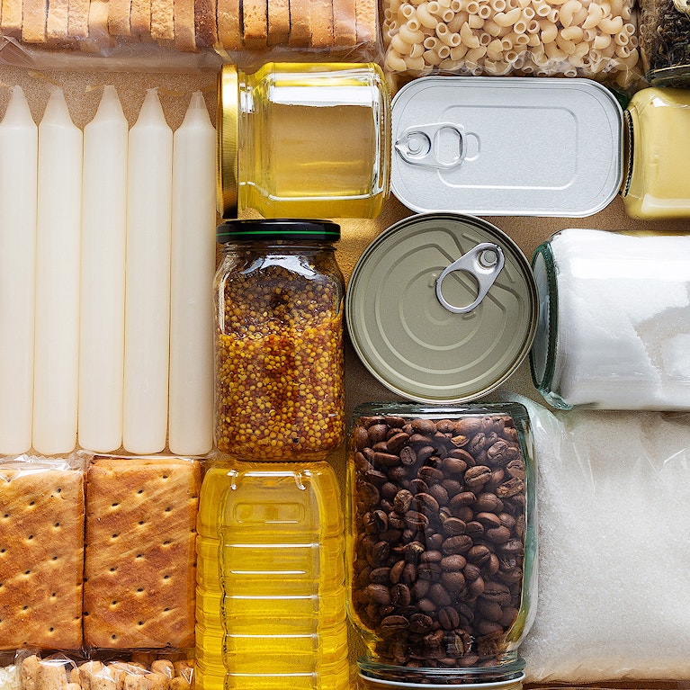 Home food supplies for quarantine and isolation, including canned food, cereals pasta and essential staples for survival, survival during military operations, the concept of stay at home