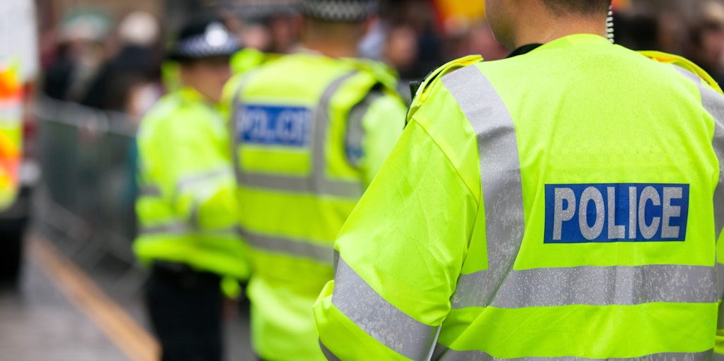 Police officers wearing high-visibility vests