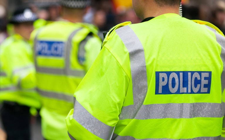 Police officers wearing high-visibility vests