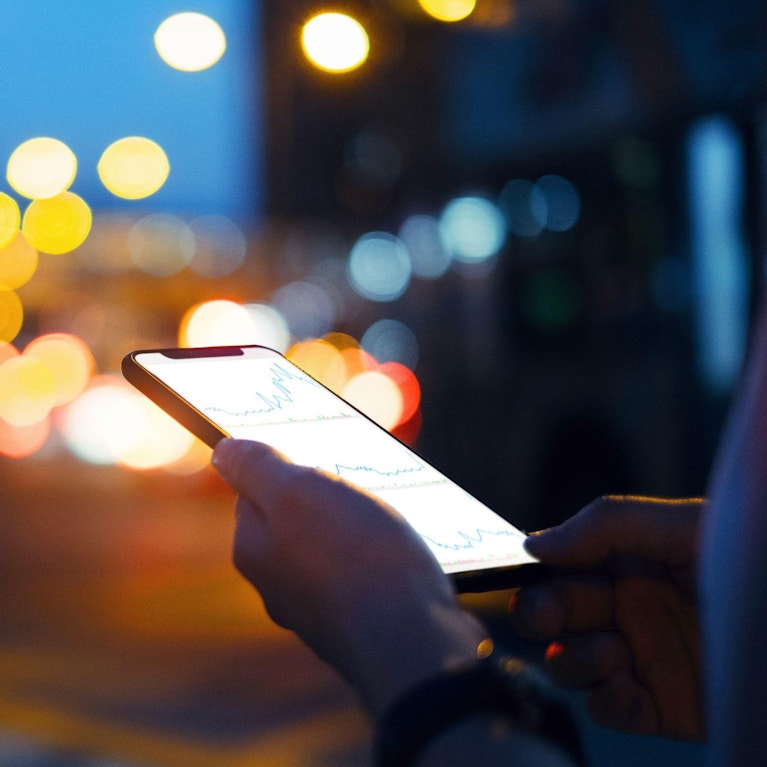 Person checking data on her phone