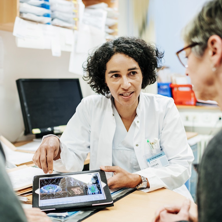 Doctor explaining test results to couple