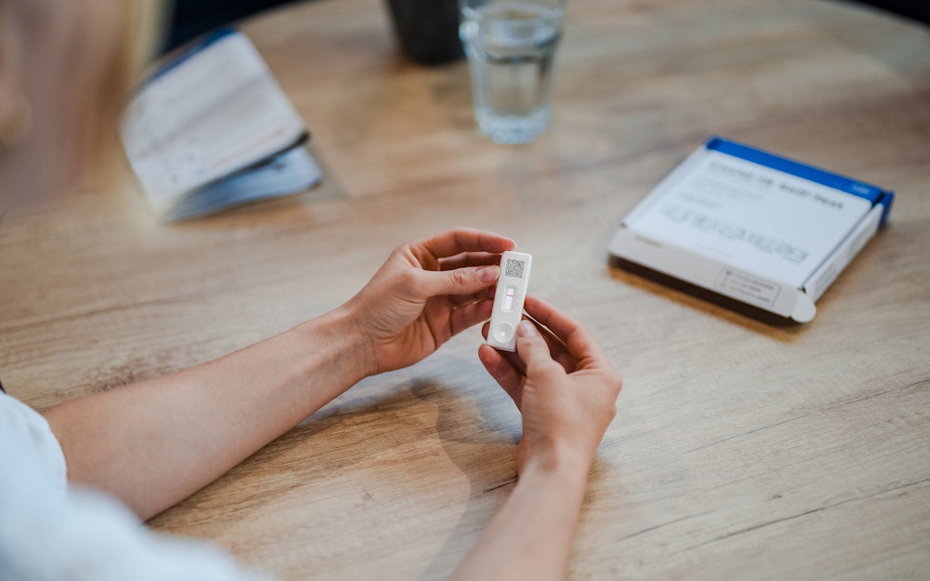 Person reading results of a lateral flow test